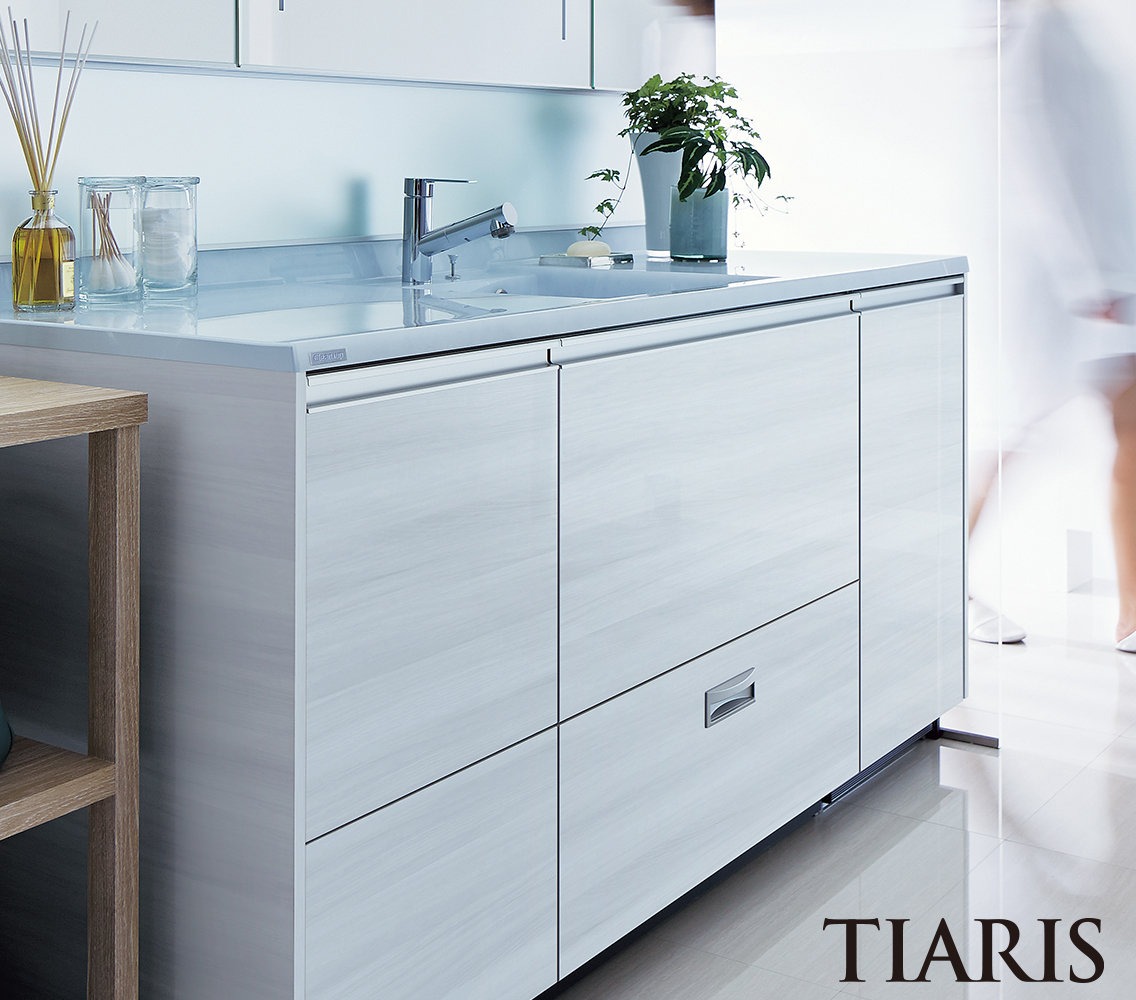 ホワイトな木目扉の引出タイプの洗面化粧台